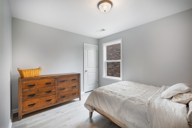 bedroom with light hardwood / wood-style floors