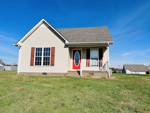 view of front of property with covered porch and a front yard