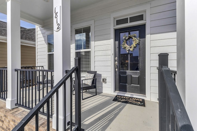 property entrance featuring covered porch