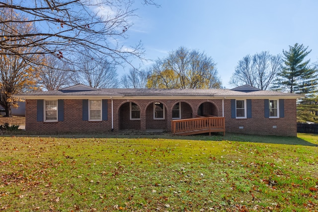 ranch-style home with a front lawn