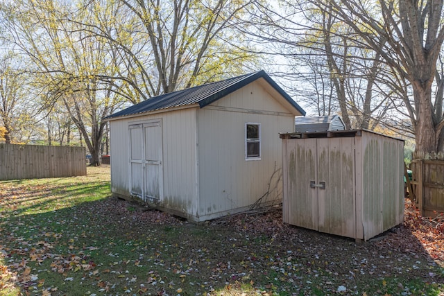 view of outdoor structure featuring a lawn