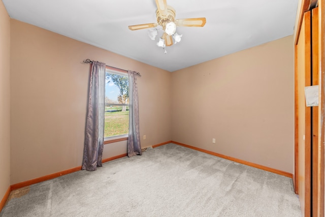 empty room featuring carpet and ceiling fan