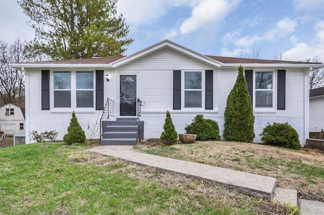 view of front of home with a front lawn