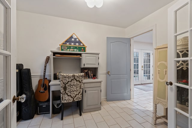 tiled home office featuring french doors