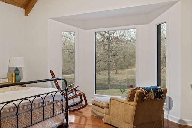 bedroom featuring hardwood / wood-style flooring and multiple windows