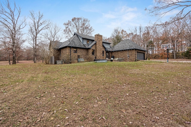 view of home's exterior featuring a yard and a garage