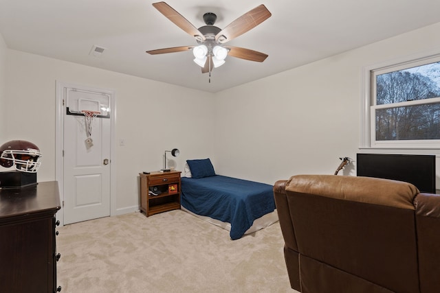 bedroom featuring light carpet and ceiling fan