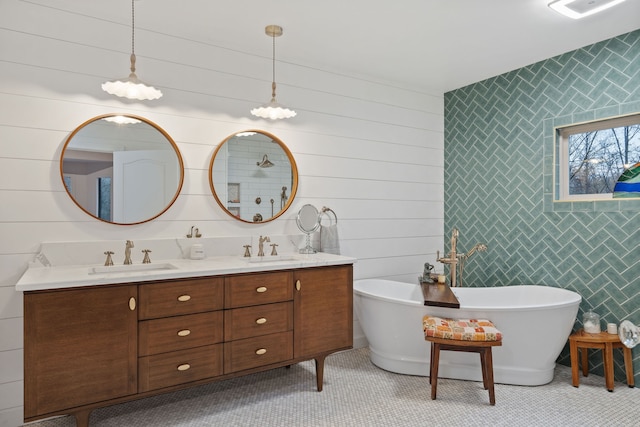 bathroom with vanity, wooden walls, tile walls, and a tub