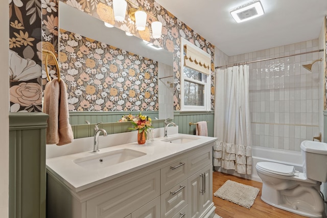 full bathroom with vanity, toilet, wood-type flooring, and shower / tub combo with curtain