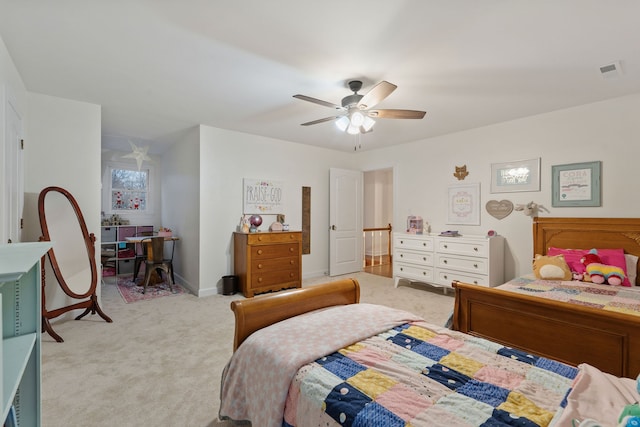 bedroom featuring light carpet and ceiling fan