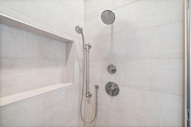 bathroom with tiled shower