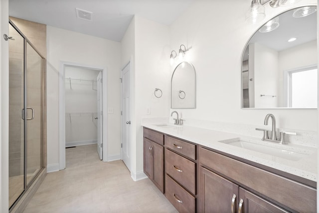 bathroom with vanity and an enclosed shower