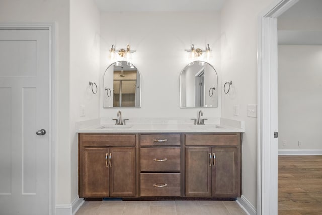 bathroom featuring hardwood / wood-style flooring and vanity