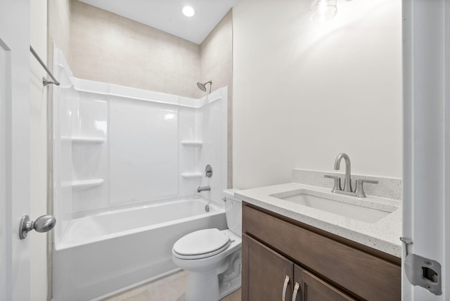 full bathroom with toilet, vanity, and tub / shower combination