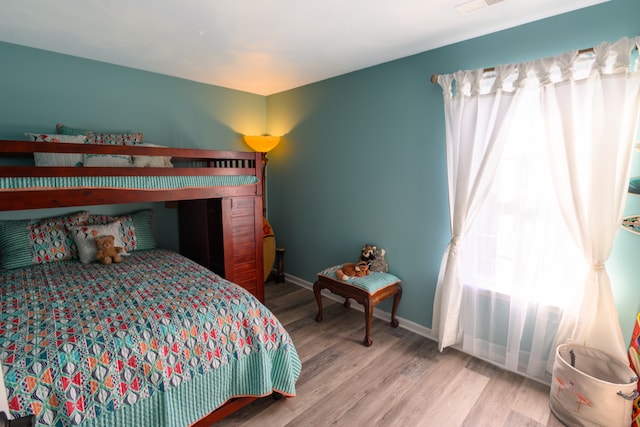 bedroom with light wood-type flooring