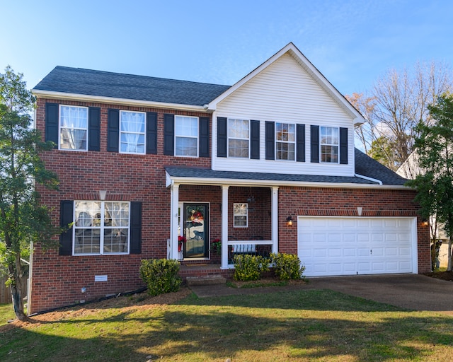 view of front facade featuring a front lawn and a garage