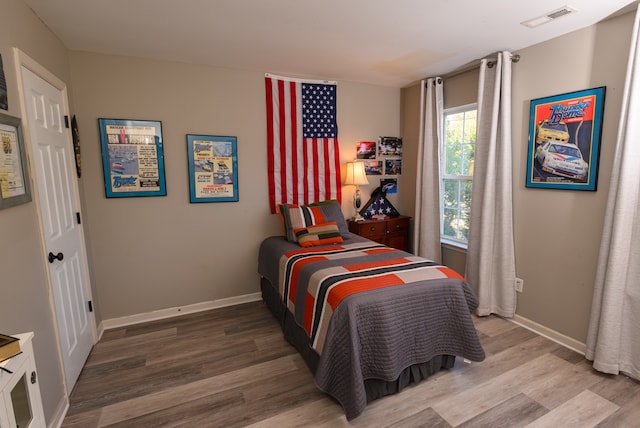 bedroom featuring hardwood / wood-style floors