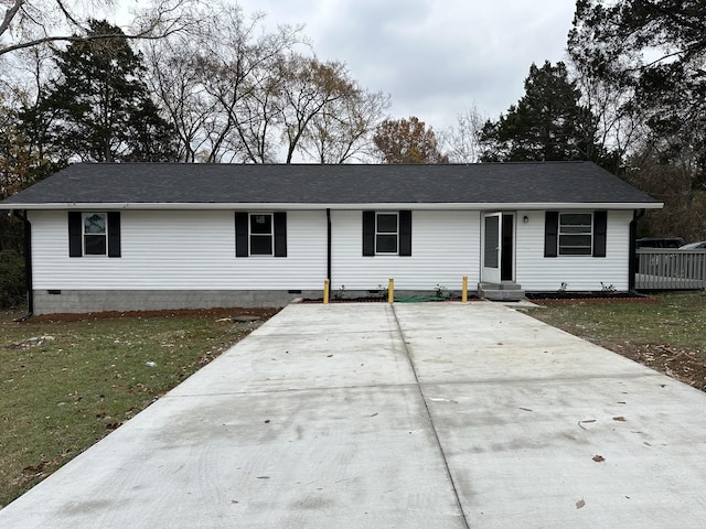 ranch-style house with a front lawn