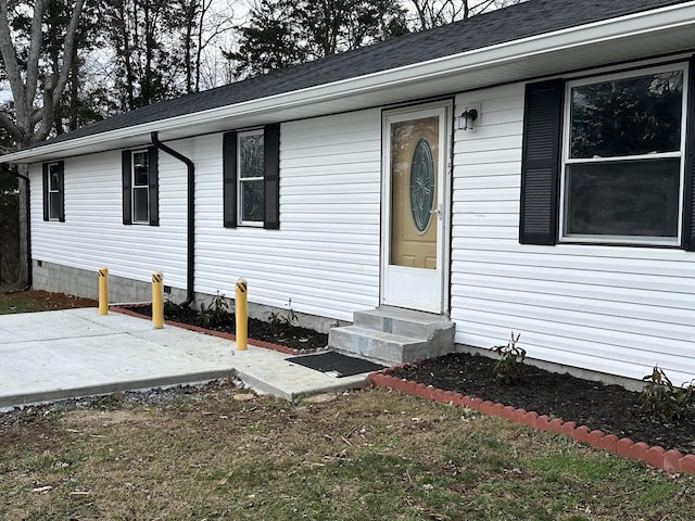 property entrance with a patio area