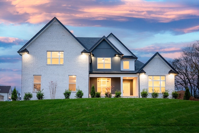 view of front of property with a yard