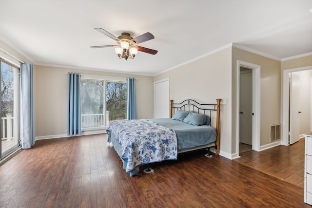 bedroom with multiple windows, ceiling fan, crown molding, and dark hardwood / wood-style floors