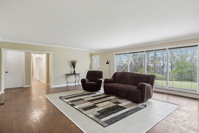 living room featuring crown molding and hardwood / wood-style flooring