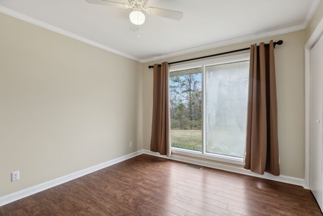 unfurnished room featuring dark hardwood / wood-style flooring, ceiling fan, and ornamental molding