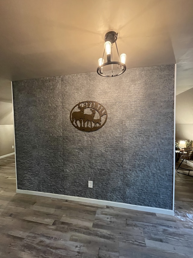 unfurnished dining area featuring dark wood-type flooring