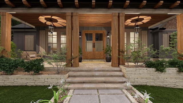 property entrance featuring ceiling fan and covered porch