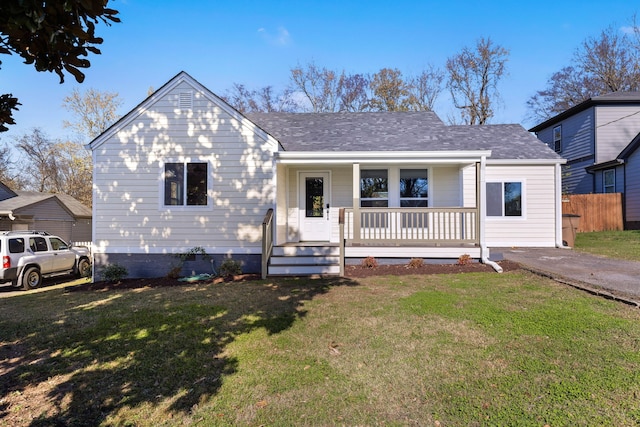 view of front facade with covered porch and a front yard