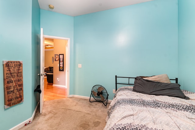 bedroom with light colored carpet