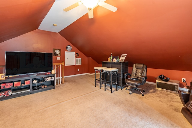 office area with ceiling fan, carpet floors, and vaulted ceiling