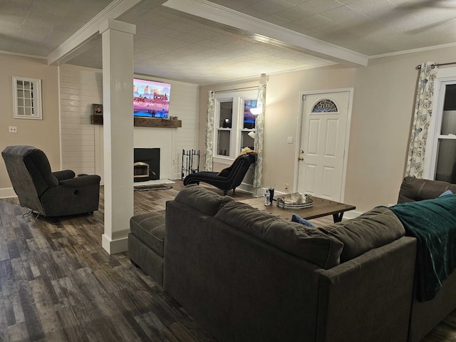 living room with beam ceiling, dark hardwood / wood-style floors, and ornamental molding