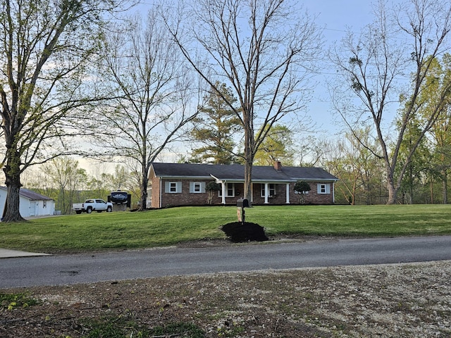 ranch-style house with a lawn