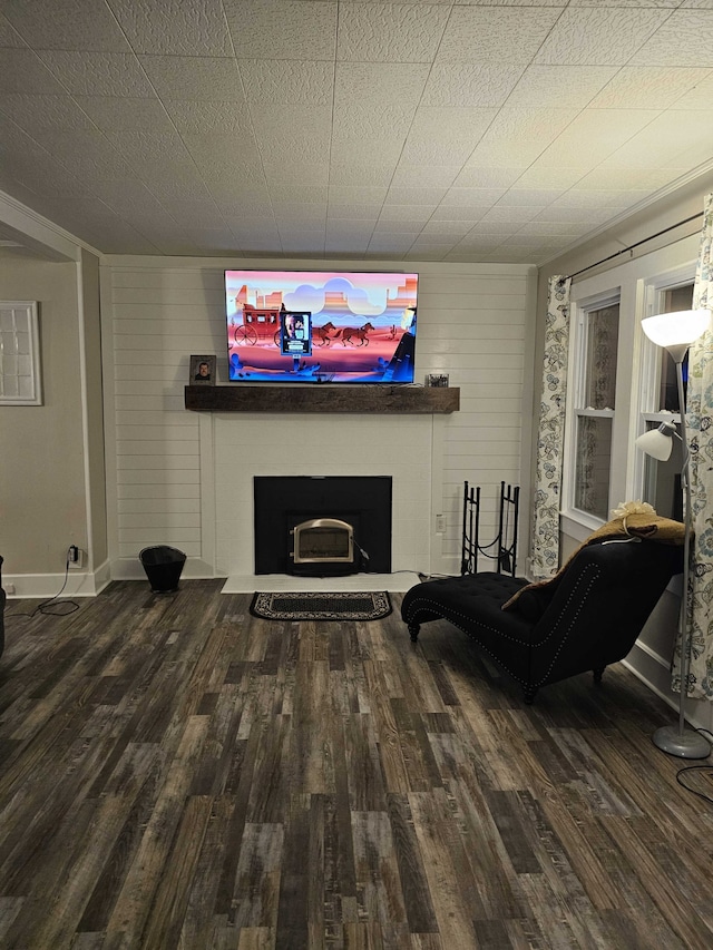 living area with wood walls and wood-type flooring