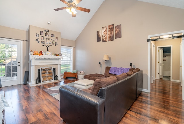 living room with ceiling fan, high vaulted ceiling, and dark hardwood / wood-style floors