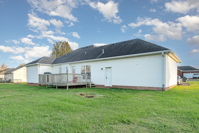 back of house with a lawn and a wooden deck