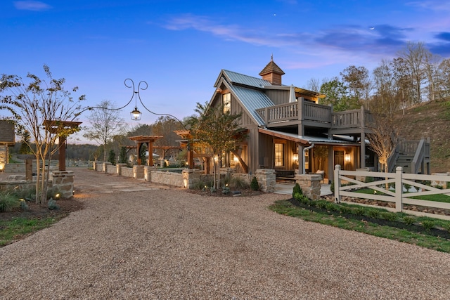 view of front of home with a balcony