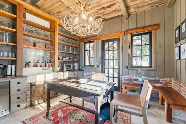 office area featuring wood ceiling and an inviting chandelier