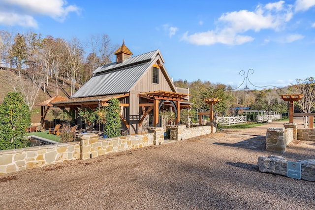 view of home's community with a pergola