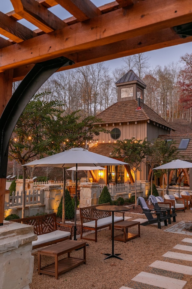 view of patio terrace at dusk