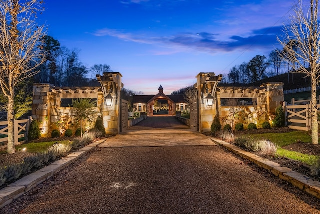 view of gate at dusk