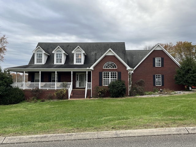 view of front facade with a front yard and a porch