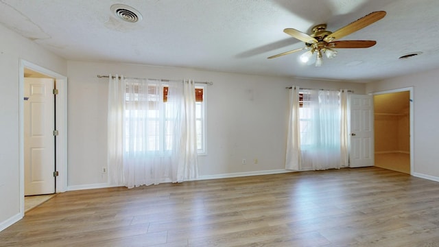 301 Burr Oak Ct, Spring Hill, TN 37174 - spare room featuring healthy amount of natural light, light wood-style floors, and a ceiling fan