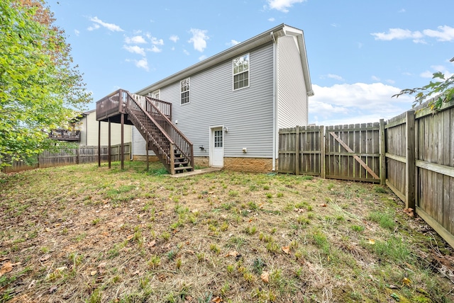 back of property with a wooden deck