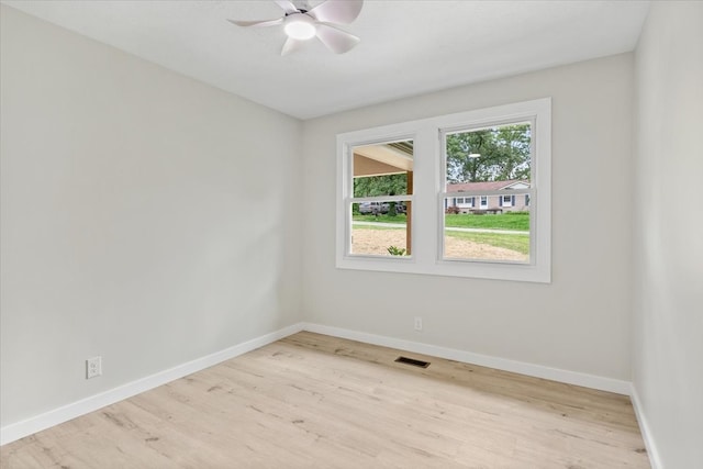 unfurnished room featuring ceiling fan and light hardwood / wood-style flooring