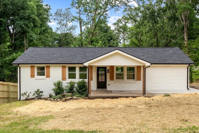 single story home with covered porch