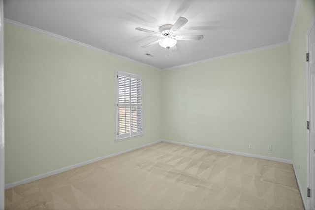 unfurnished room featuring light carpet, ceiling fan, and ornamental molding