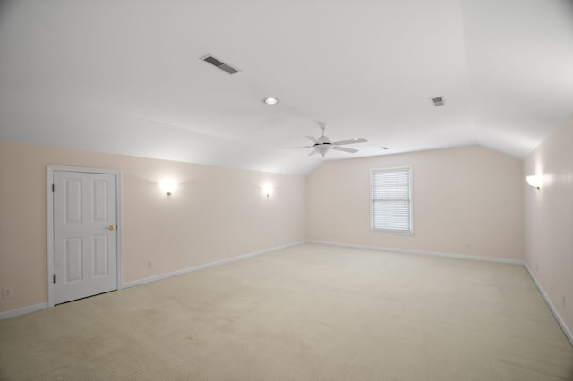 bonus room with ceiling fan, light colored carpet, and vaulted ceiling