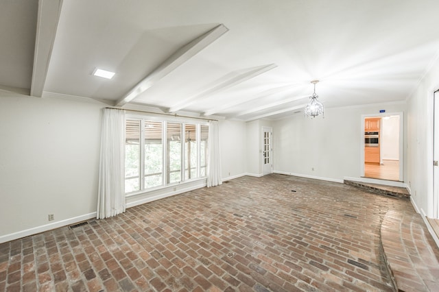 spare room featuring brick floor, baseboards, a chandelier, and beamed ceiling